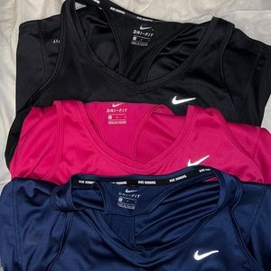 Three Nike workout tanks